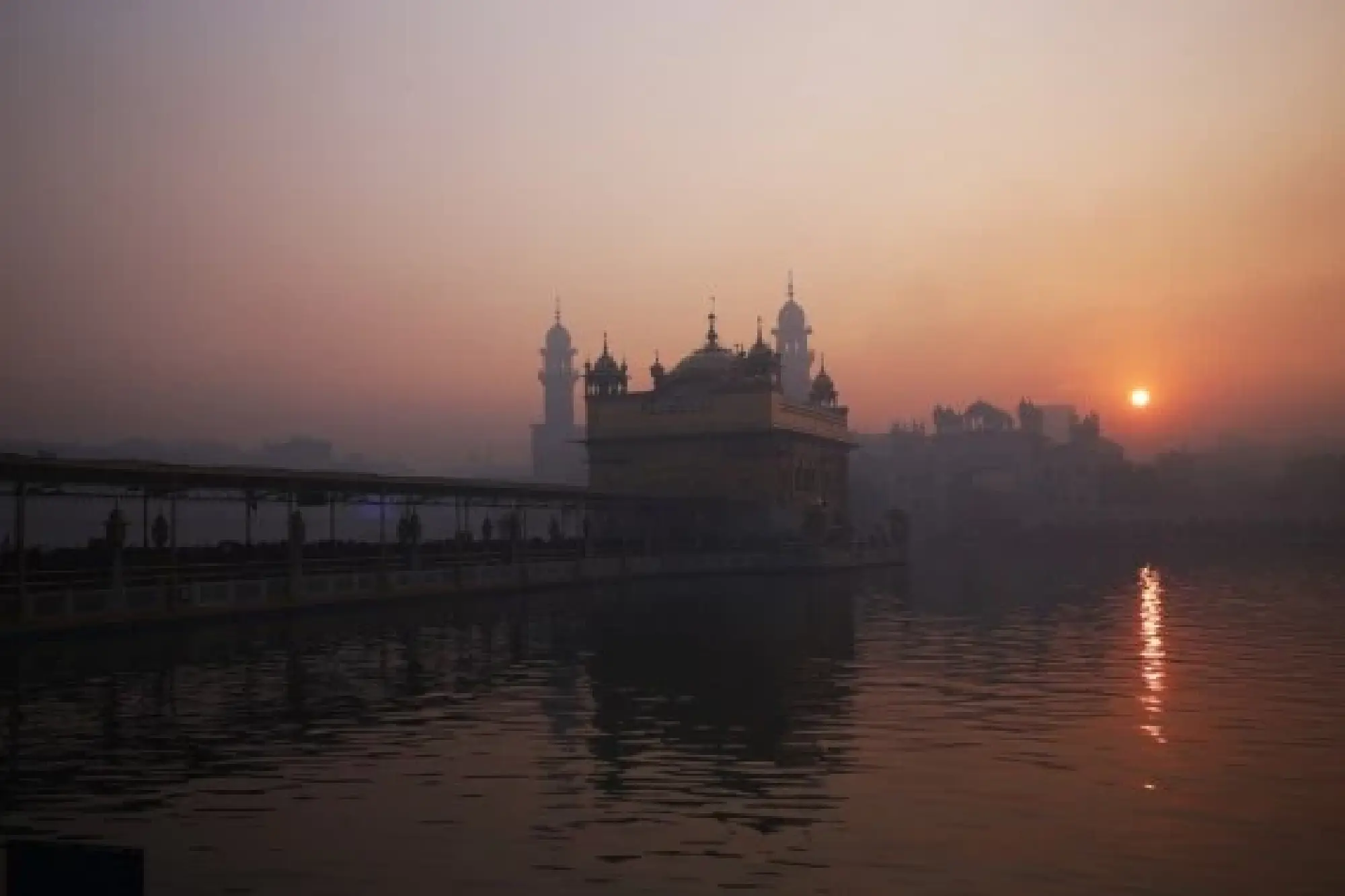 First sun of the New Year rises in the backdrop of the Golden Temple in Amritsar of India's northern Punjab state, Jan. 1, 2022. (Xinhua/Stringer) 