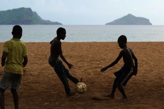 Boys play football on the beach in Moheli, Comoros, Jan. 8, 2022. (Xinhua/Dong Jianghui)