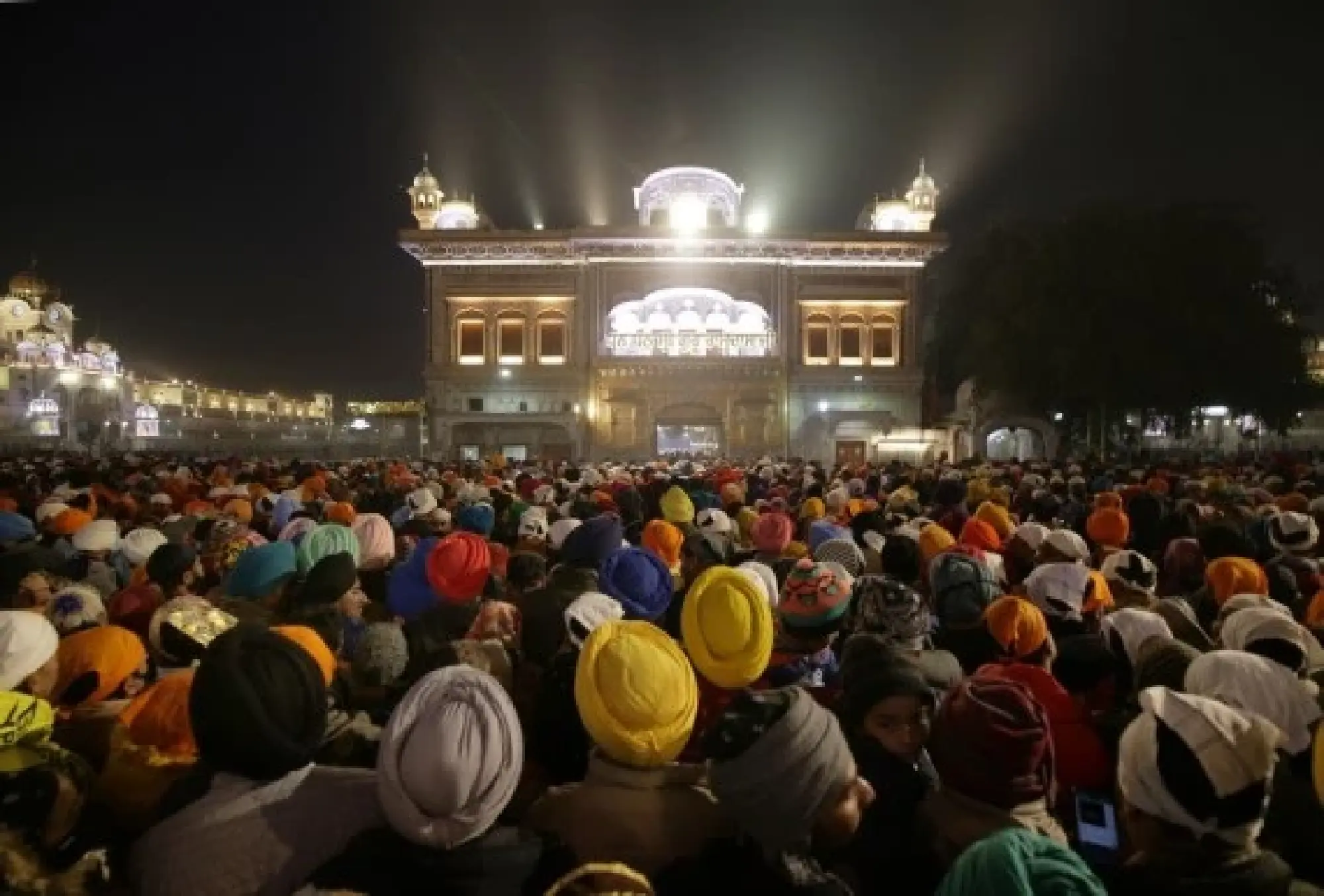 Devotees queue to pay obeisance in the pre-dawn hours at the Golden Temple on New Year's day in Amritsar of India's northern state of Punjab, Jan. 1, 2022. (Str/Xinhua) 