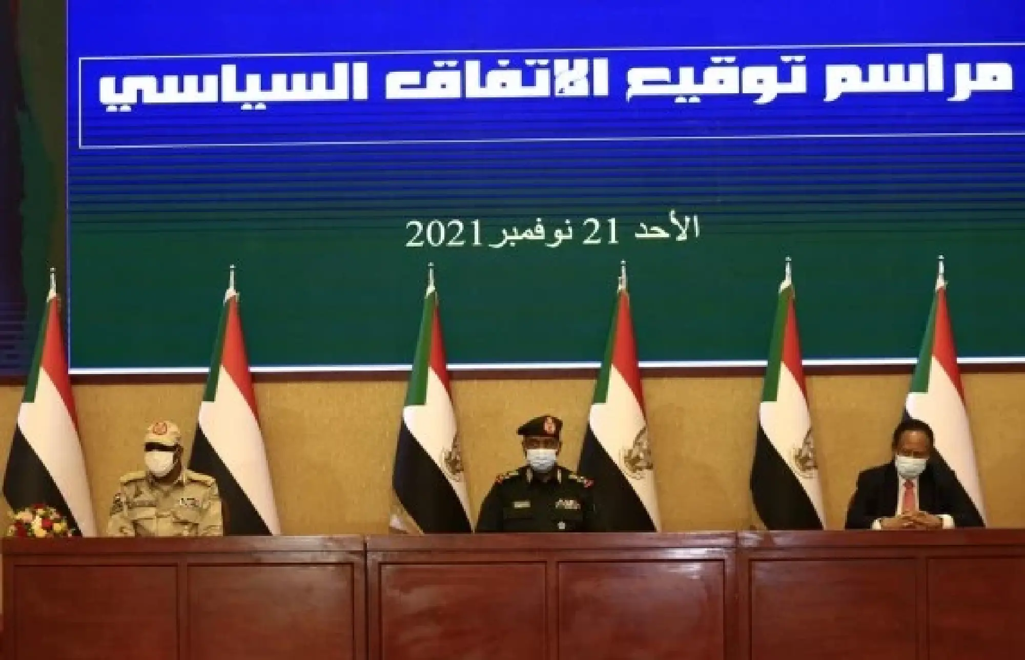 Photo taken on Nov. 21, 2021 shows the signing ceremony of a political declaration between General Commander of the Sudanese Armed Forces Abdel Fattah Al-Burhan (C) and then Prime Minister Abdalla Hamdok (R) in Khartoum, Sudan. (Xinhua/Mohamed Khidir)