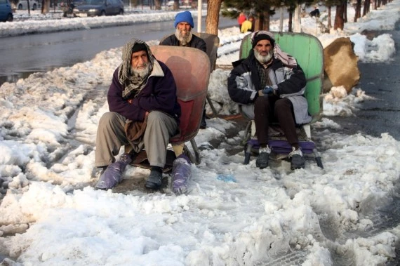 People wait for work in Kabul, Afghanistan, Jan. 5, 2022.  (Photo by Saifurahman Safi/Xinhua)