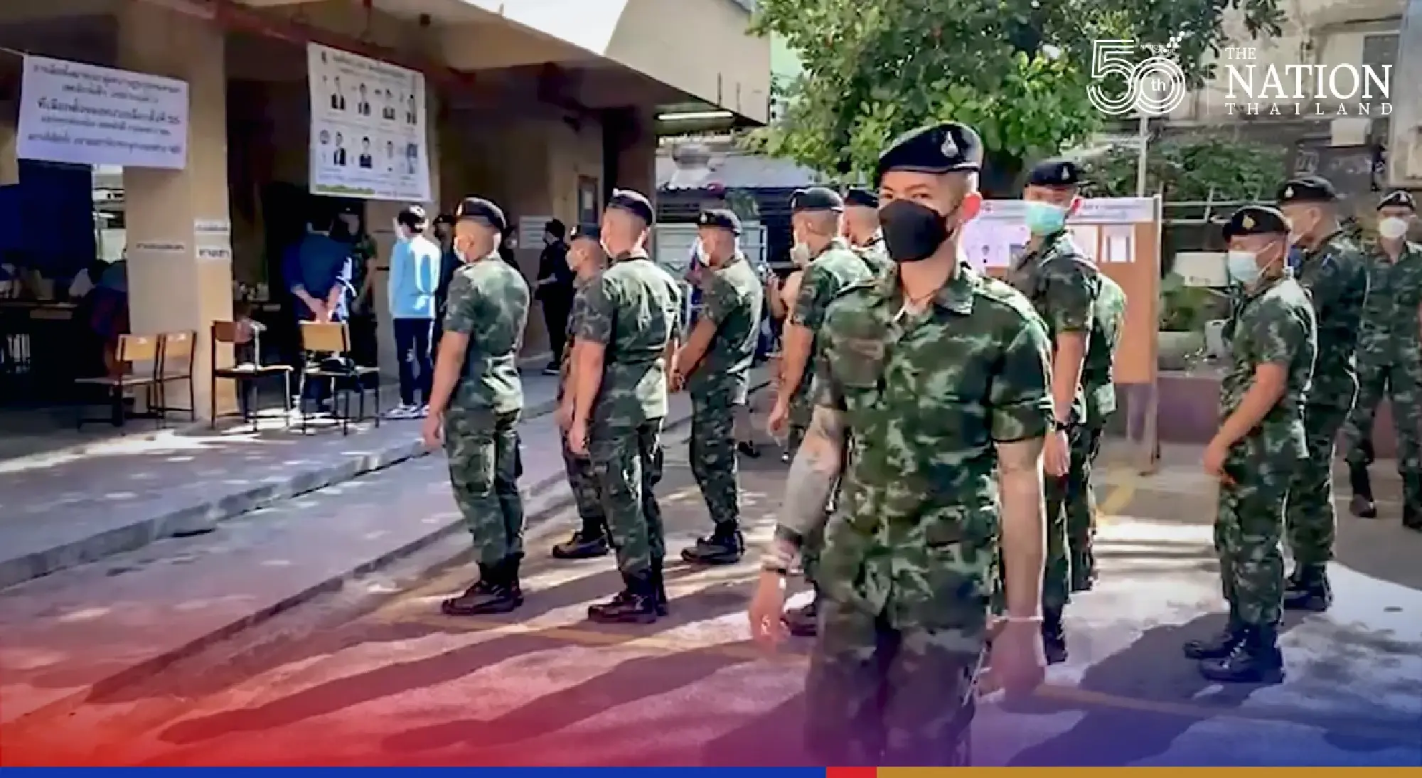 Soldiers line up to vote as polling booths open in Bangkok