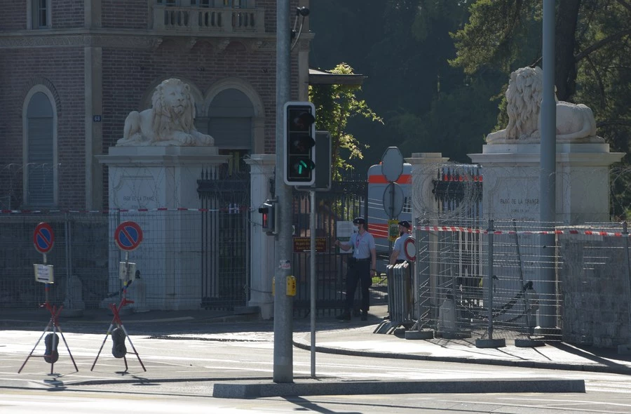 Photo taken on June 15, 2021 shows security officers stand guard at an entrance to the Villa La Grange, the venue for a summit in Geneva, Switzerland, between U.S. President Joe Biden and his Russian counterpart Vladimir Putin. (Xinhua/Guo Chen)