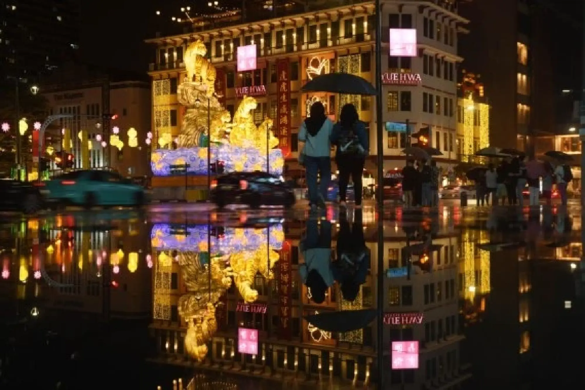 People view the tiger-themed lantern decorations celebrating the upcoming Chinese New Year, the Year of the Tiger, at Singapore's Chinatown area, Jan. 7, 2022. (Photo by Then Chih Wey/Xinhua)
