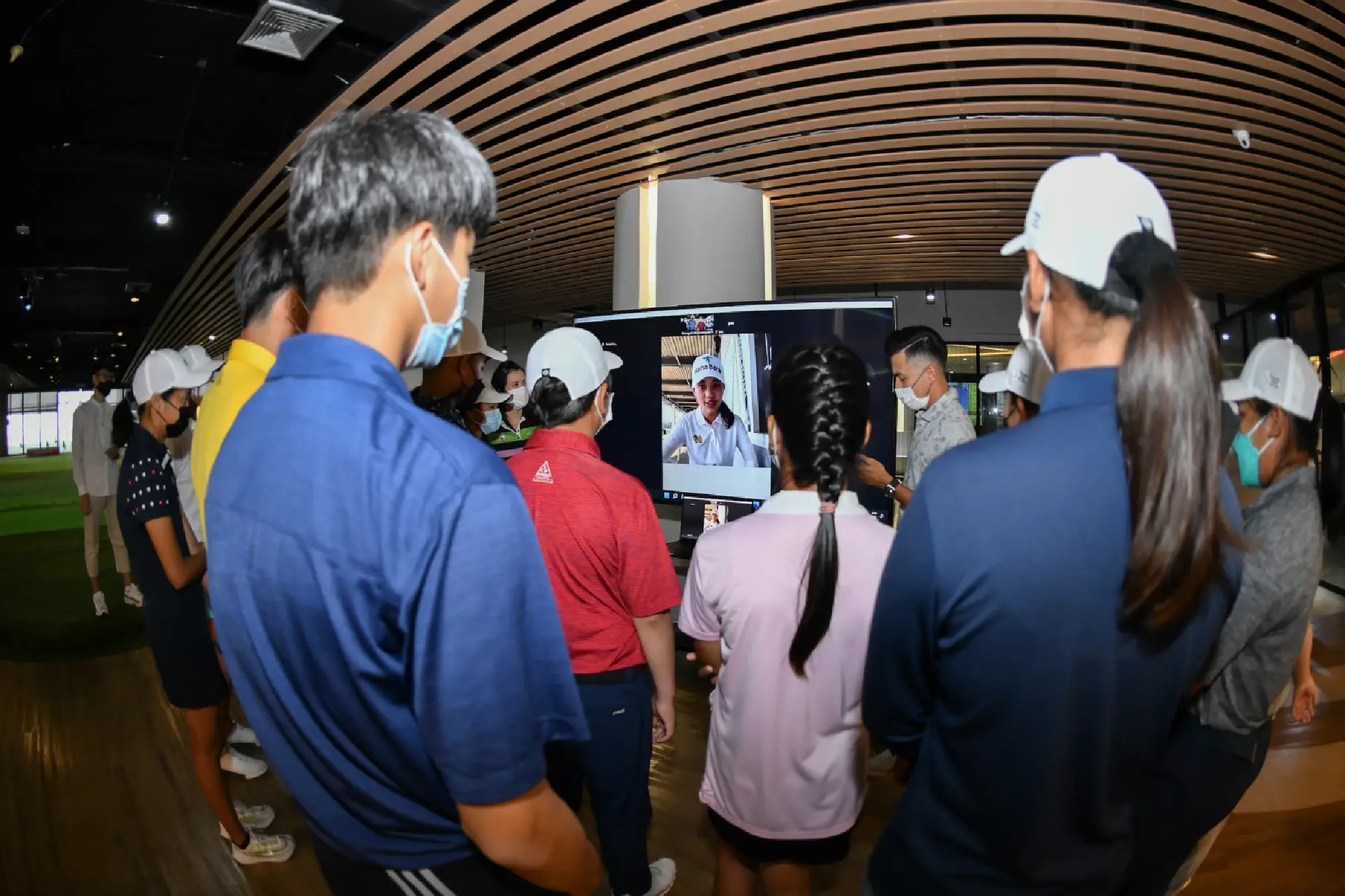 Young and aspiring golf players train with professional golfers at Trust Golf 