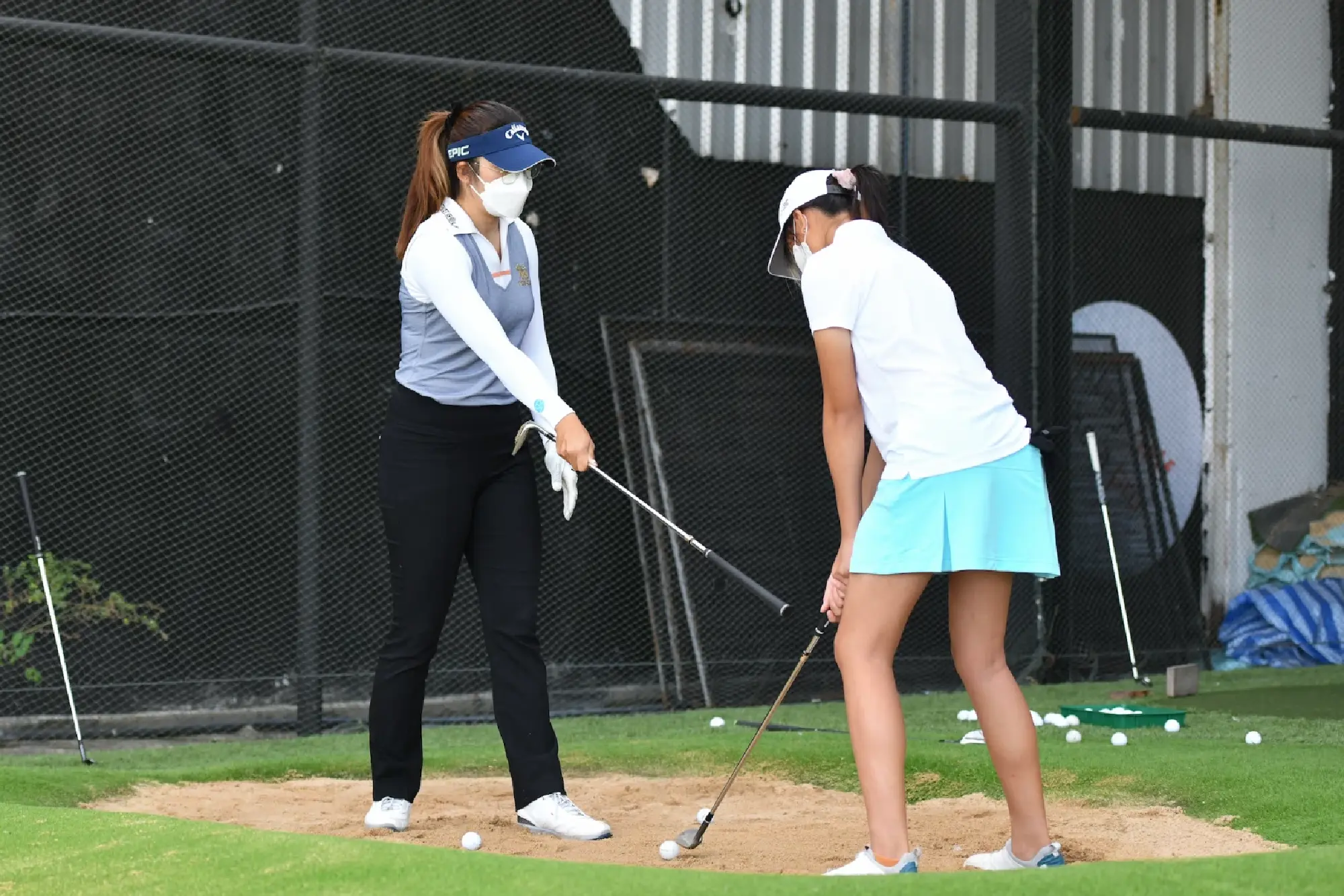 Young and aspiring golf players train with professional golfers at Trust Golf 