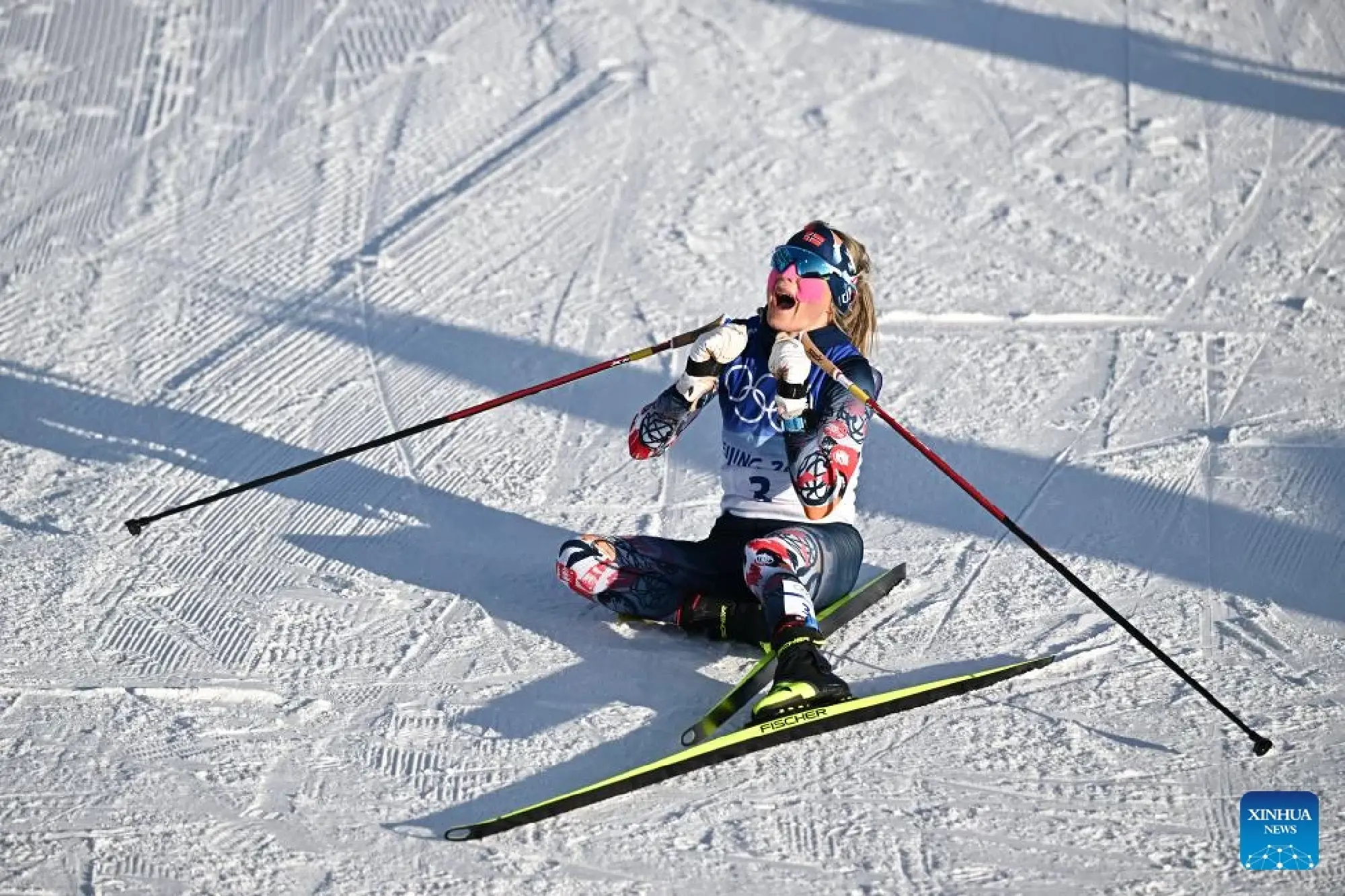 Norway's Therese Johaug celebrates after winning the Cross-Country Skiing Women's 7.5km + 7.5km Skiathlon at National Cross-Country Skiing Centre in Zhangjiakou, north China's Hebei Province, Feb. 5, 2022. (Xinhua/Xiao Yijiu)