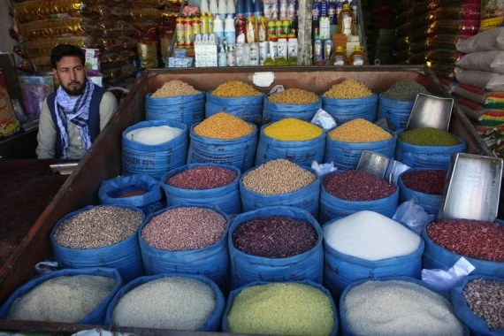 An Afghan shopkeeper waits for customers in Kabul, capital of Afghanistan, Feb. 12, 2022.  (Photo by Saifurahman Safi/Xinhua)
