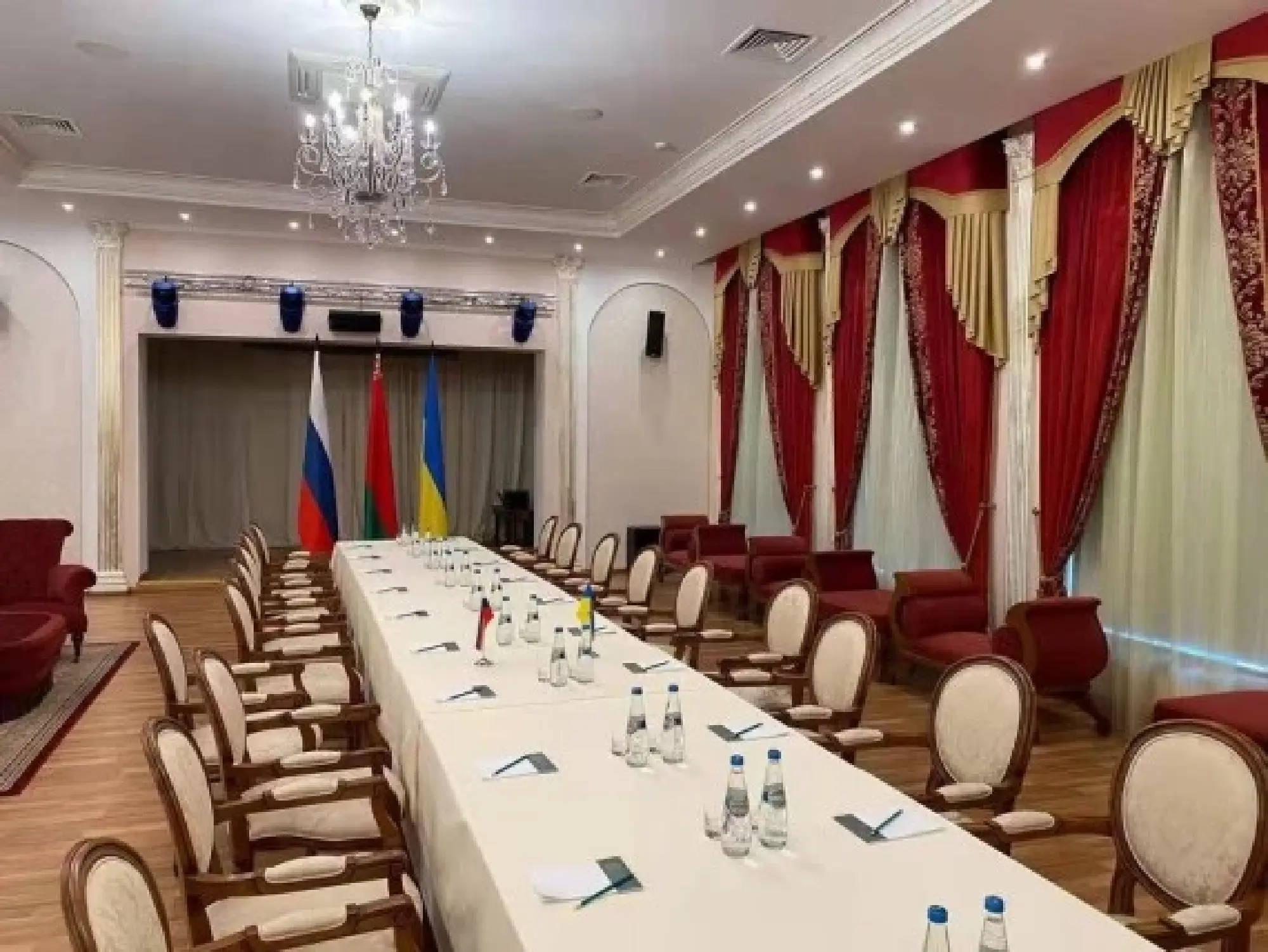 Photo provided by Belarusian Foreign Ministry shows the prepared room for the talks between Russia and Ukraine. (Belarusian Foreign Ministry/Handout via Xinhua)
