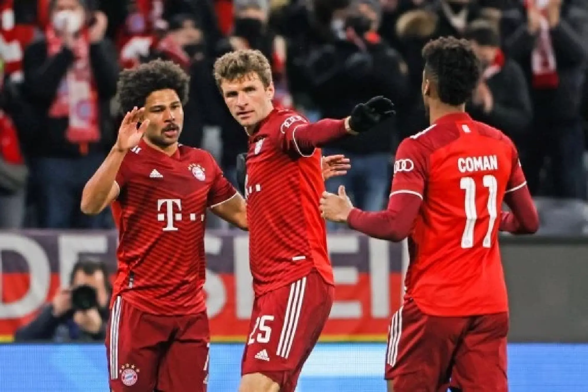 Serge Gnabry (L) celebrates scoring with his Bayern Munich teammates Thomas Muller (C) and Coman during their Champions League win over FC Salzburg on March 8, 2022. (Photo by Philippe Ruiz/Xinhua)
