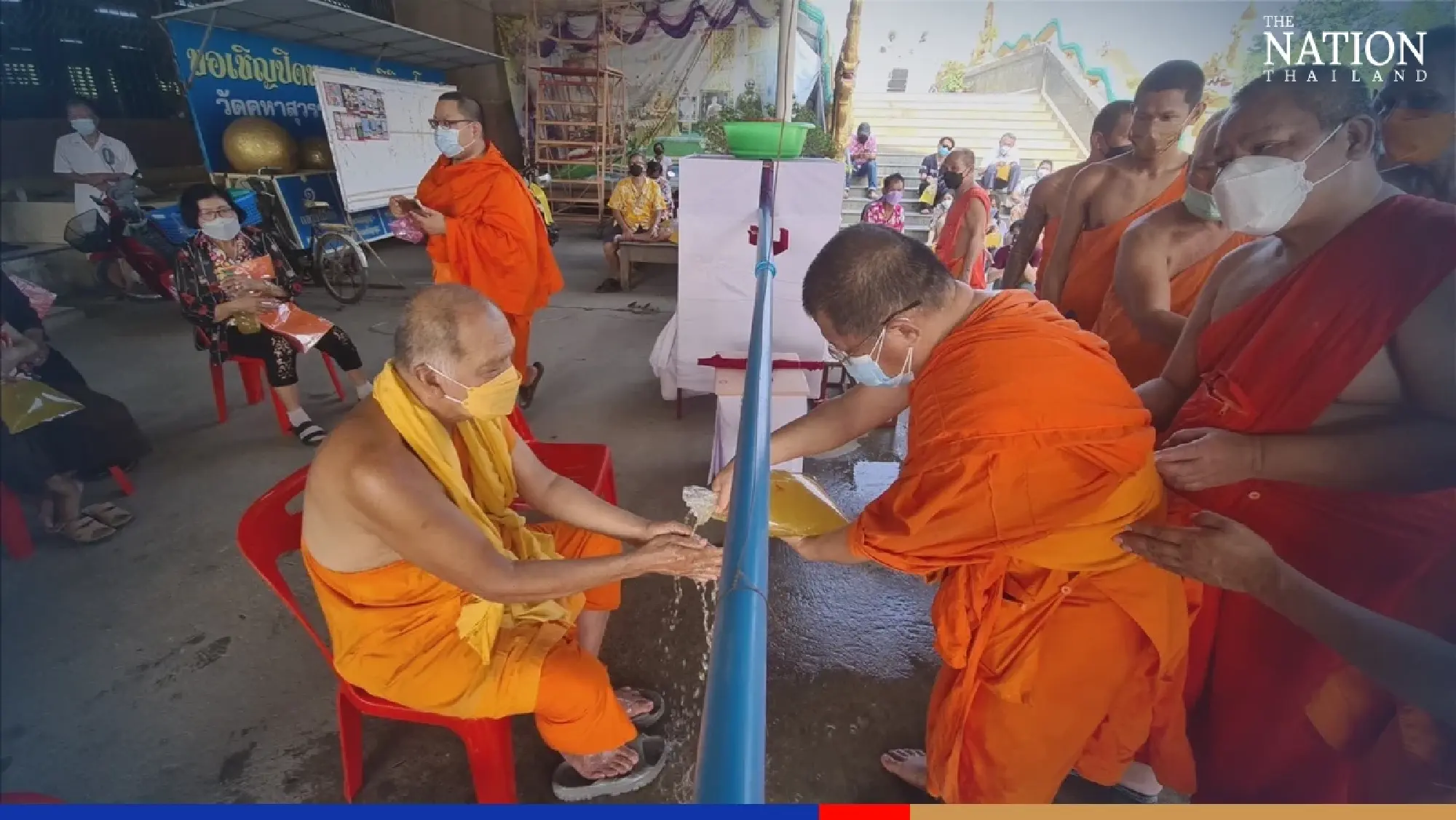 Sukhothai temple finds ingenious way of Covid-proofing Songkran ritual