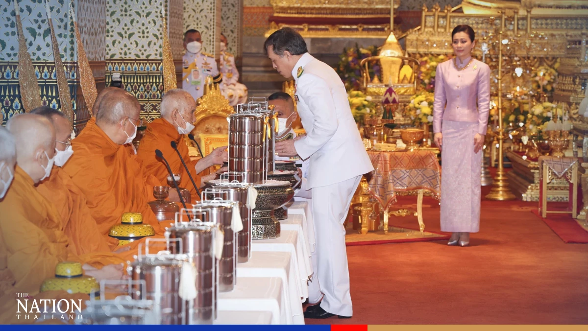 Their Majesties attend Songkran merit-making ceremony