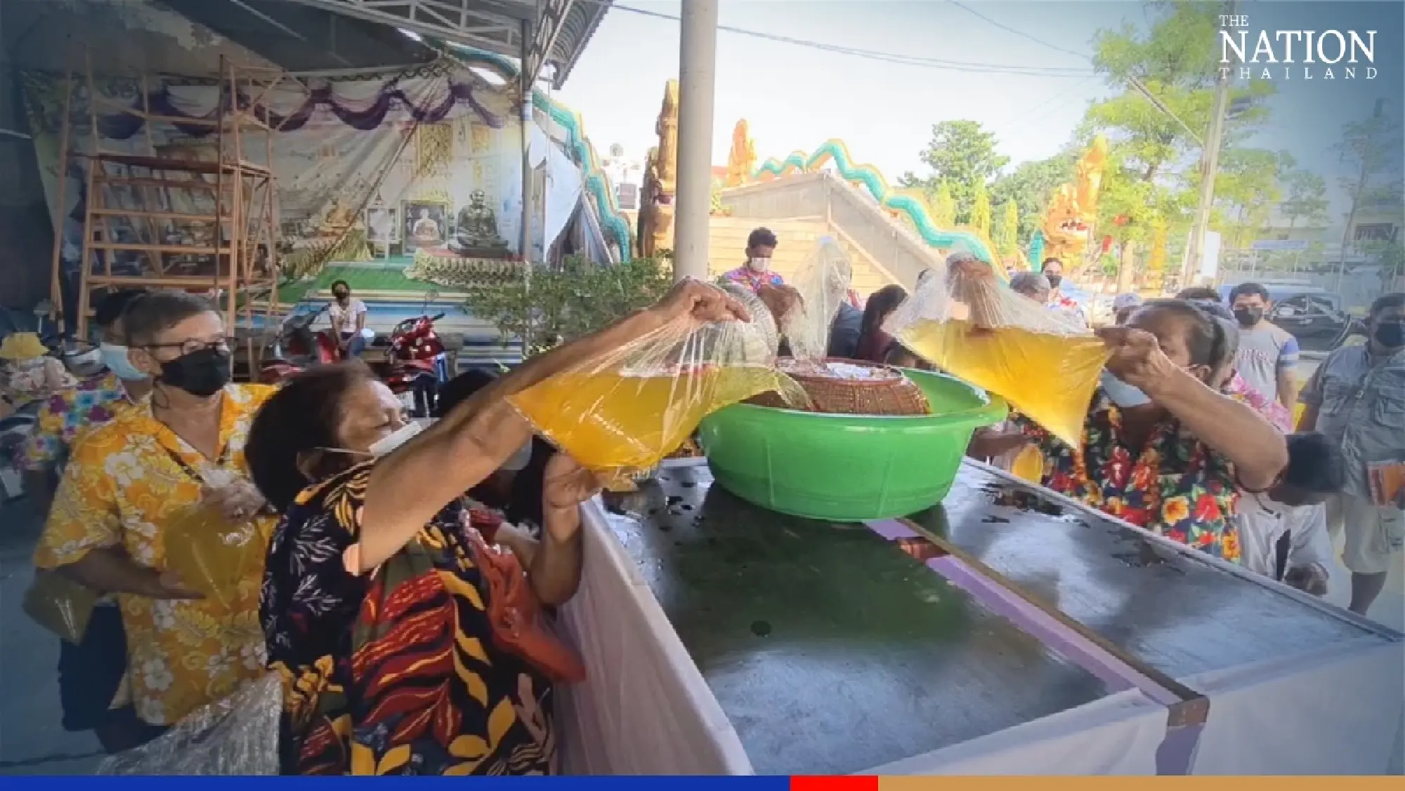 Sukhothai temple finds ingenious way of Covid-proofing Songkran ritual