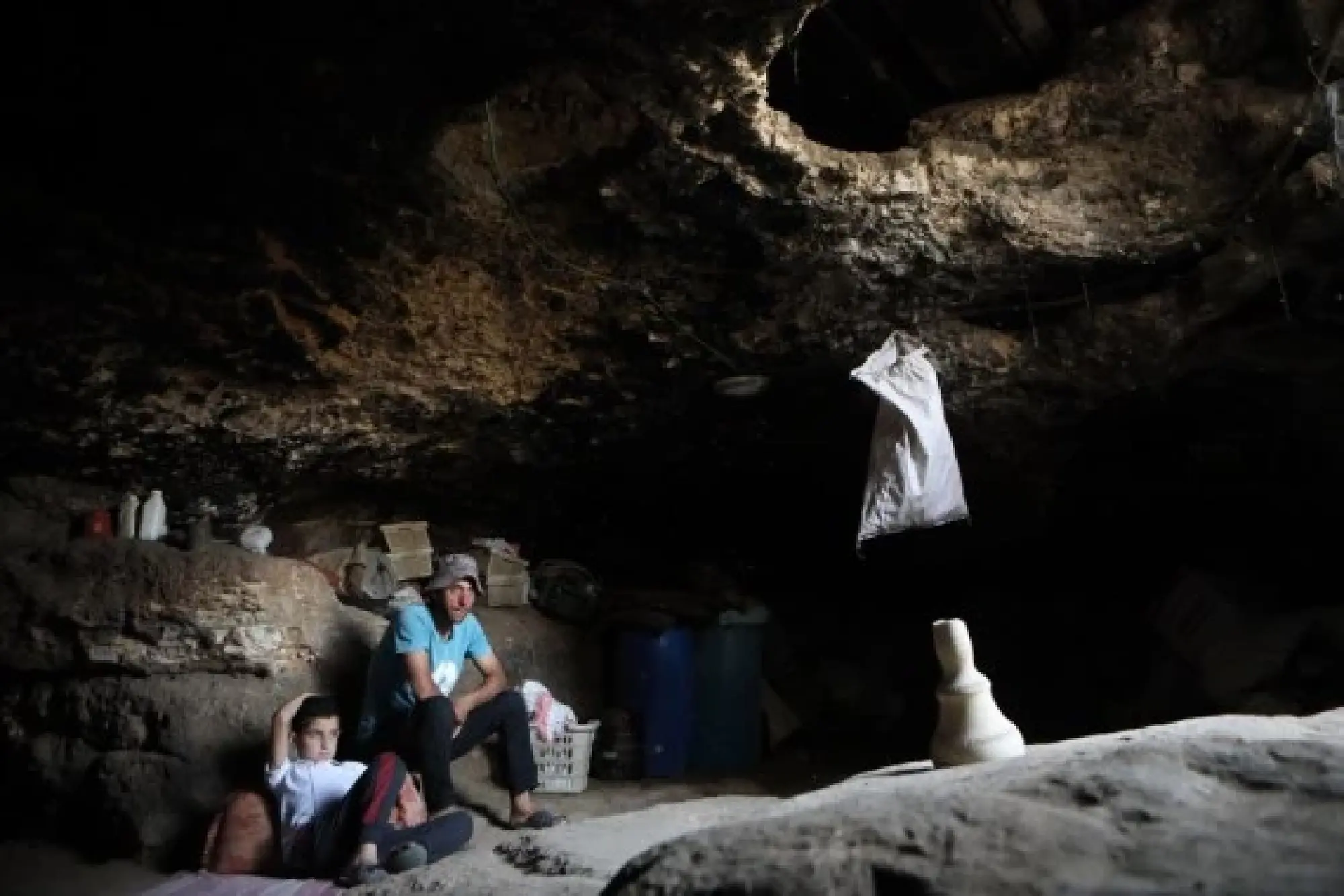 Members of the al-Tell family are seen inside a cave, at Khirbet Zanuta village, south of the West Bank city of Hebron, on April 17, 2022. (Photo by Mamoun Wazwaz/Xinhua)