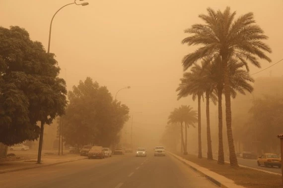 A dust storm hits Baghdad, Iraq, on May 16, 2022. A dust storm swept across much of Iraq on Monday, sending more than 2,000 people to hospitals with respiratory problems and forcing the closure of airports, schools and some government offices. (Xinhua/Khalil Dawood)