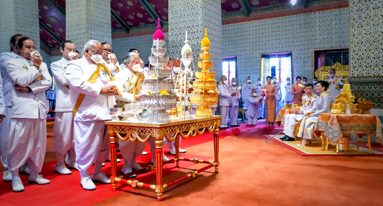 Their Majesties make merit on Coronation Day