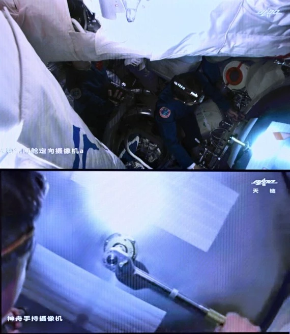 Screen image captured at Beijing Aerospace Control Center on June 5, 2022 shows Chinese astronaut Chen Dong opening the hatch door of the space station core module Tianhe.(Xinhua/Li Xin)