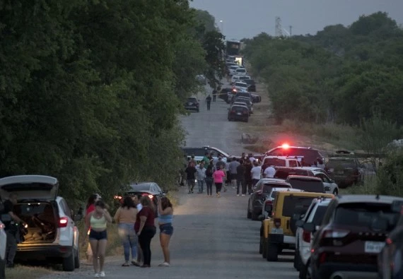 People gather at the scene of an alleged human smuggling mass casualty event in San Antonio, Texas, the United States, on June 27, 2022. (Photo by Nick Wagner/Xinhua)