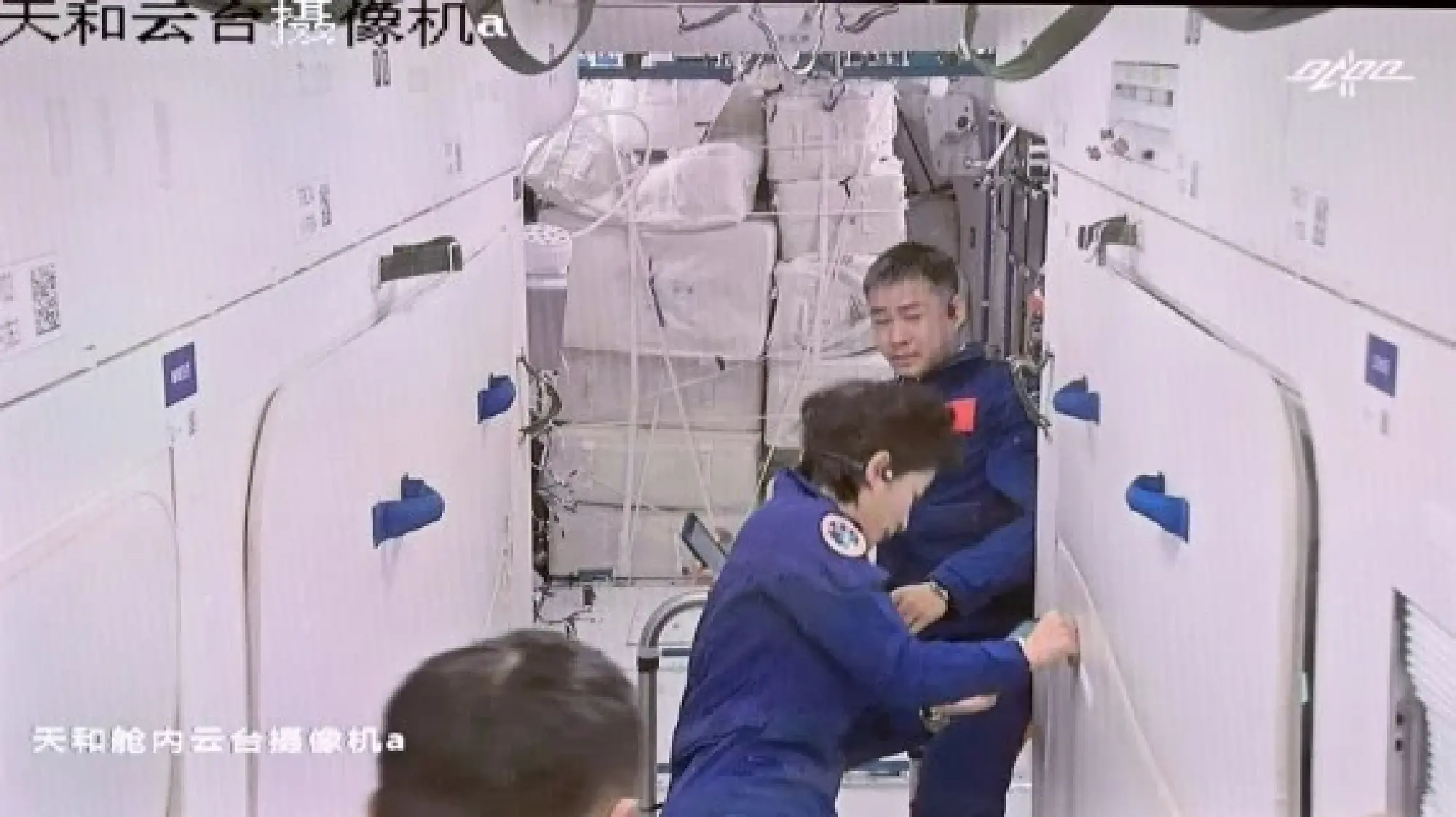 Screen image captured at Beijing Aerospace Control Center on June 5, 2022 shows three Chinese astronauts entering the space station core module Tianhe. (Xinhua/Li Xin)