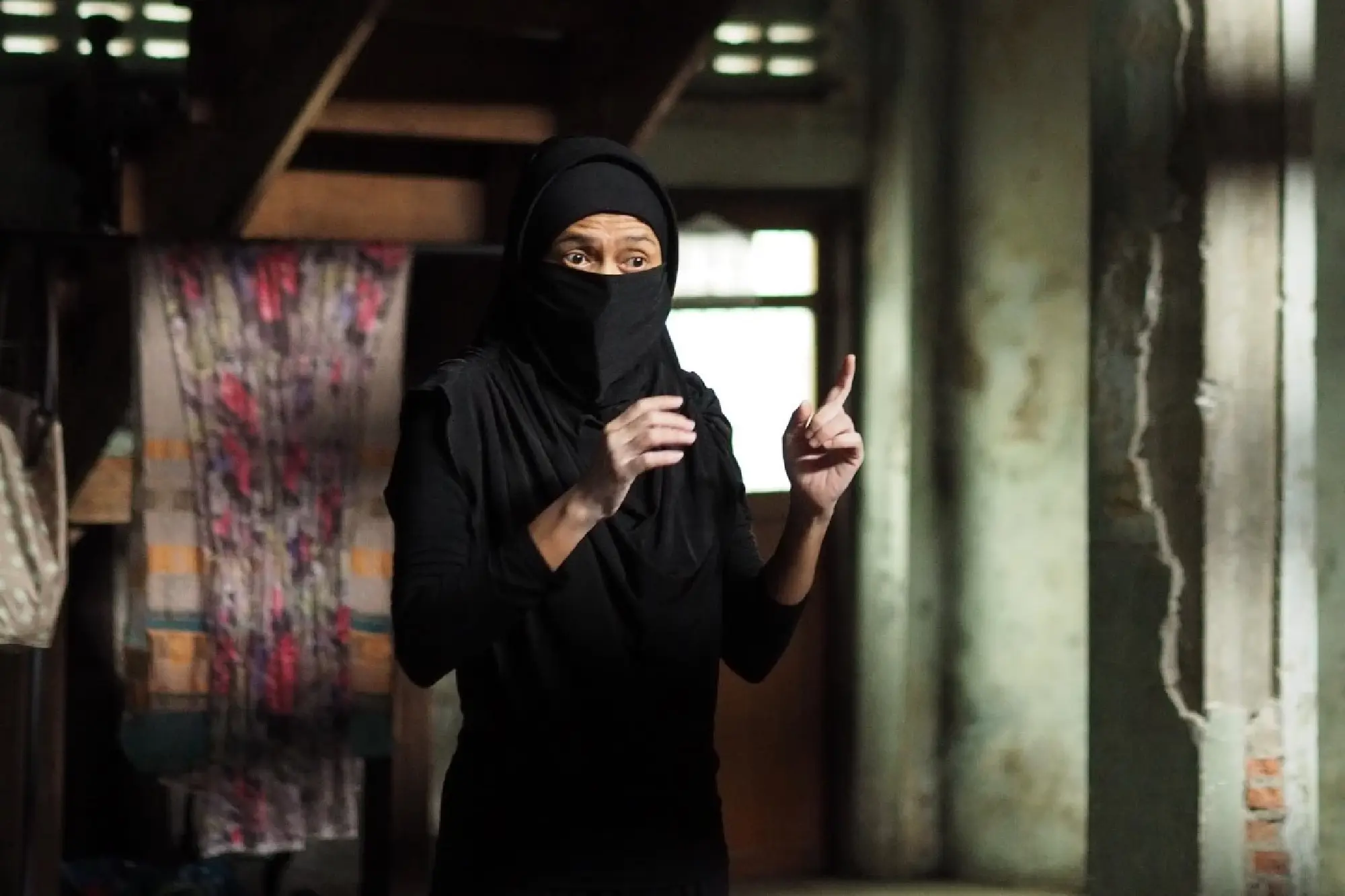 Living and acting through controversial veil