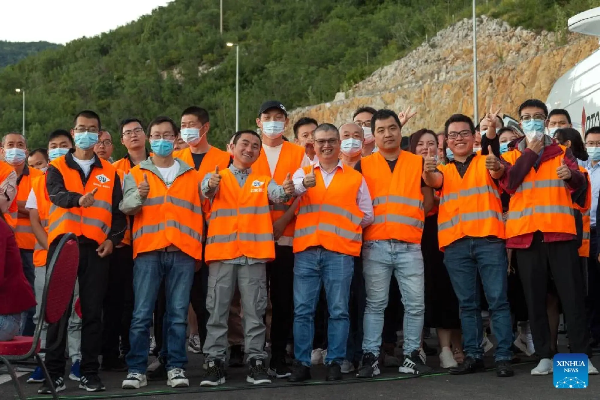 Representatives of the China Road and Bridge Corporation attend the opening ceremony of the Chinese-built highway section in Podgorica.