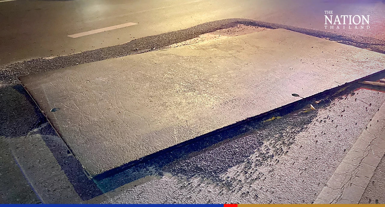 Loose metal plate on Phaholyothin Road poses danger to motorbikes