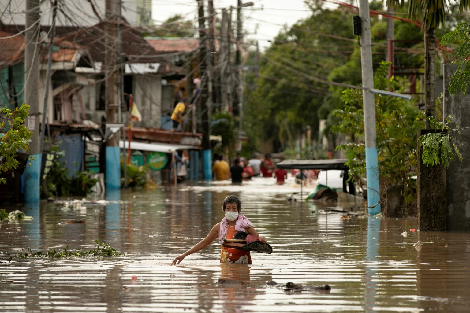 Heavy rains from Typhoon Noru flood houses in northern Philippines