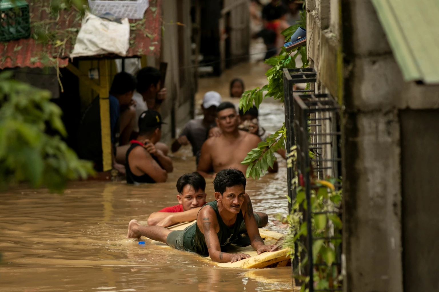 Heavy rains from Typhoon Noru flood houses in northern Philippines