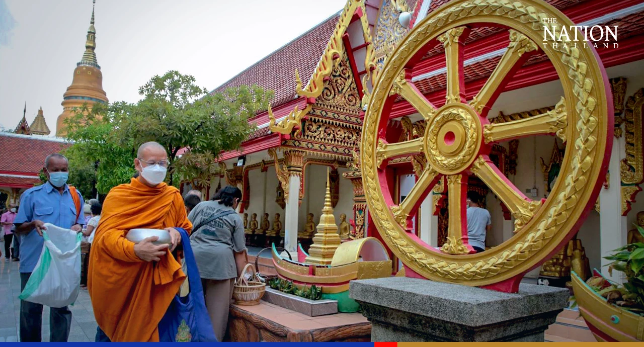 Devout Buddhists flock to temples to give alms as monks mark end of Lent