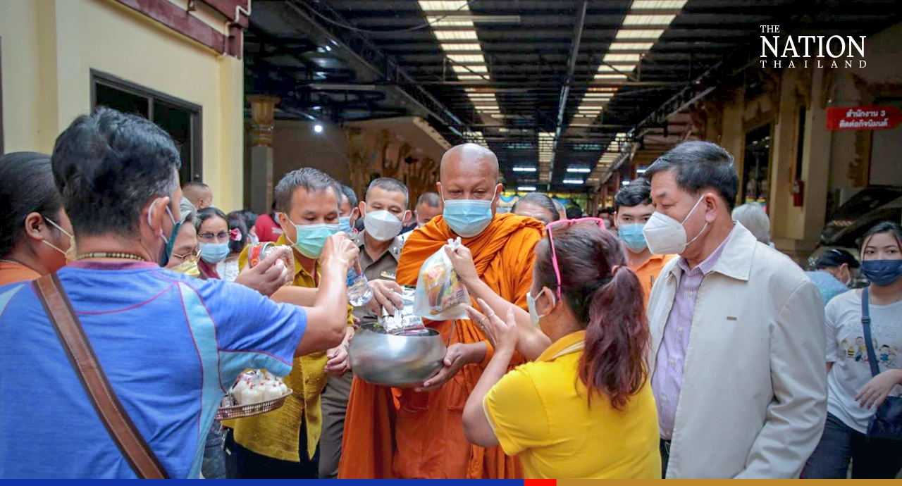 Devout Buddhists flock to temples to give alms as monks mark end of Lent