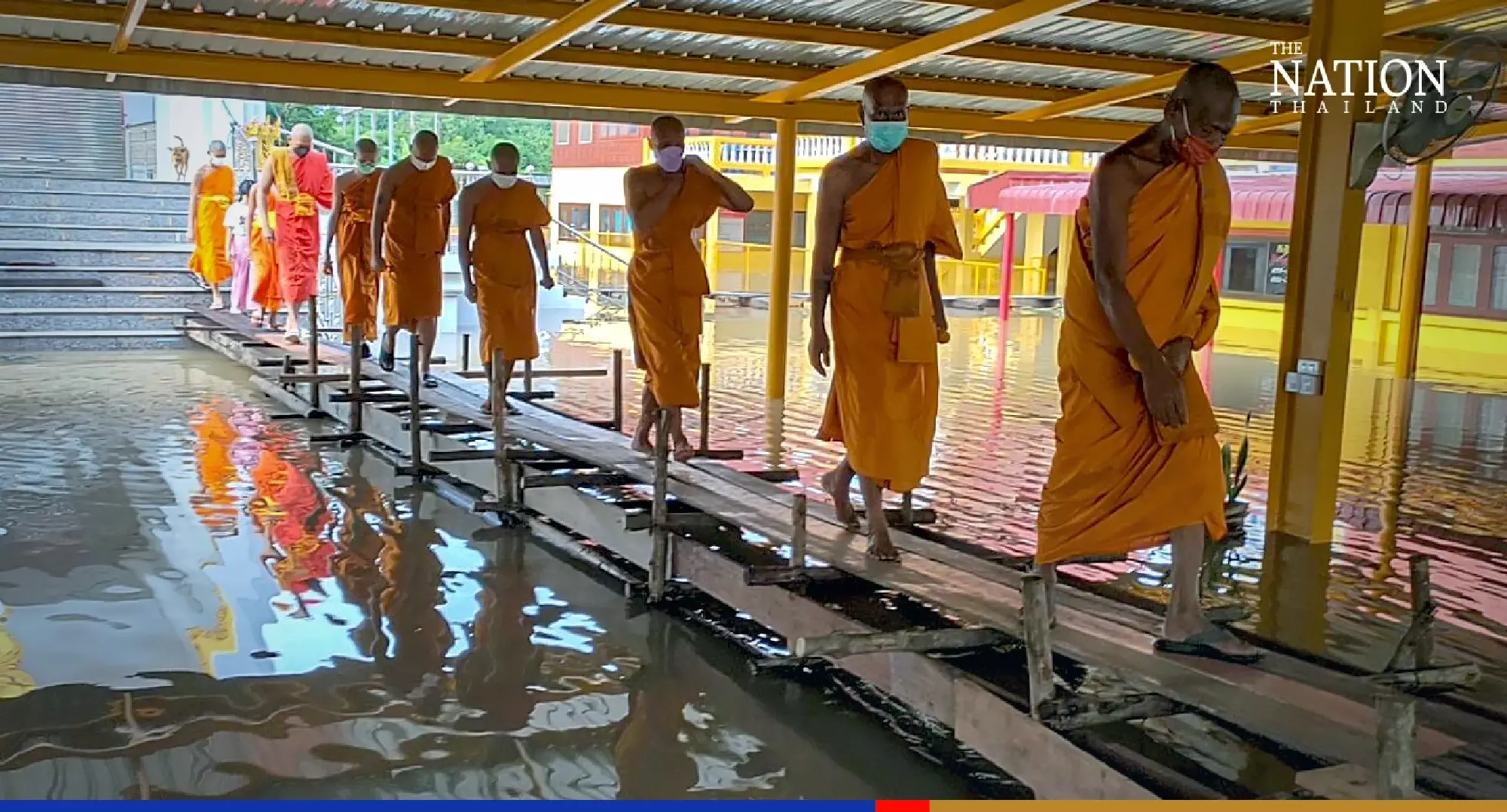 Ayutthaya residents brave floods to make merit at end of rains retreat