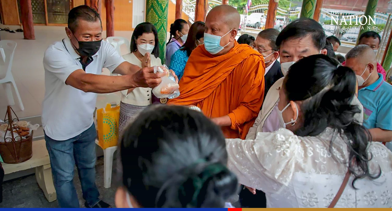 Devout Buddhists flock to temples to give alms as monks mark end of Lent