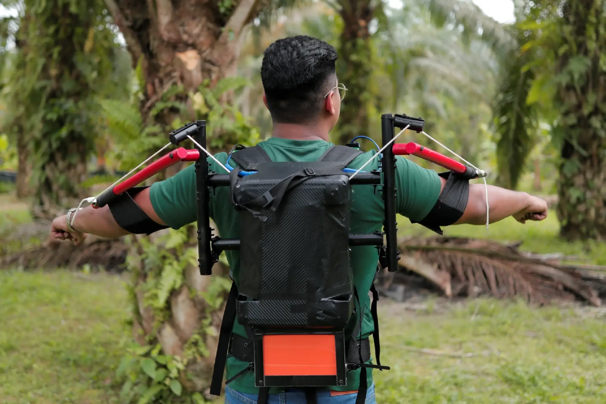 Malaysia unveils exoskeleton to boost palm oil harvesting amid labour crunch