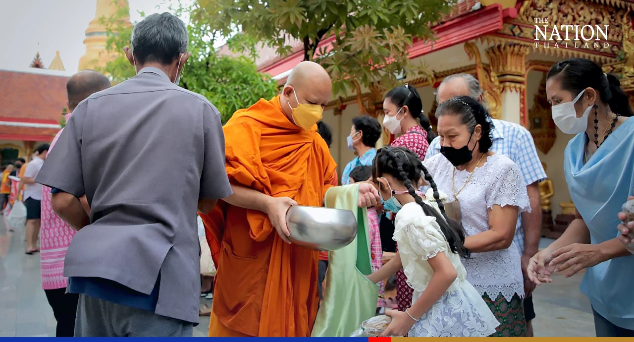 Devout Buddhists flock to temples to give alms as monks mark end of Lent