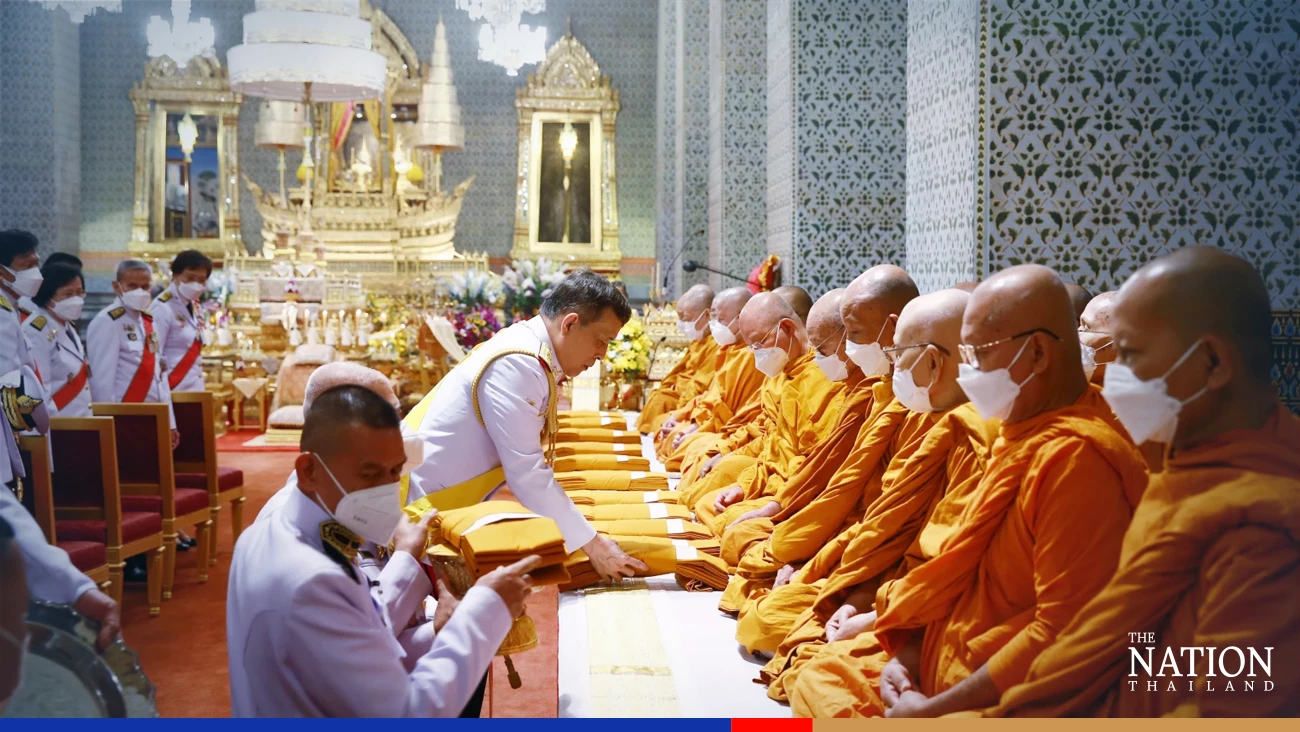 Their Majesties make merit on King Bhumibol Adulyadej the Great Memorial Day