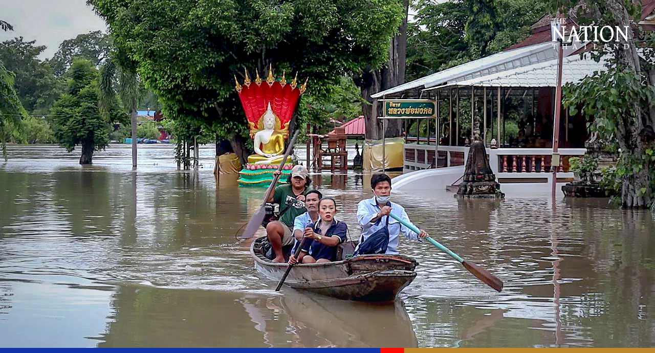 Ayutthaya residents brave floods to make merit at end of rains retreat
