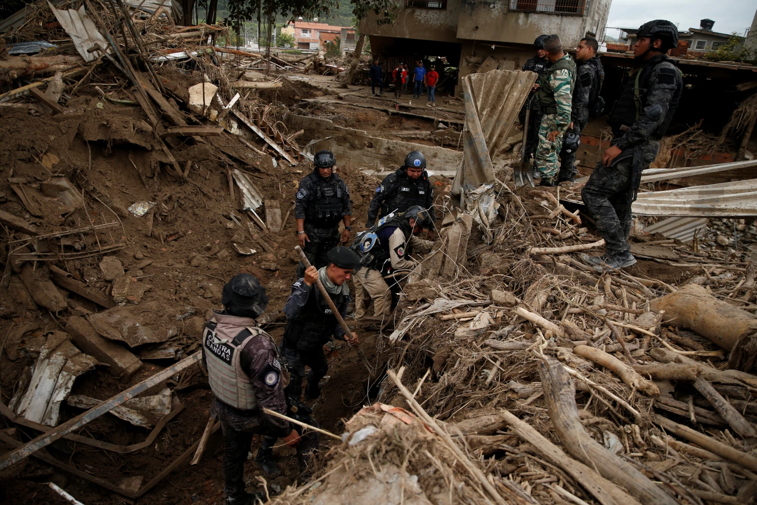 Rescue personnel works in Las Tejerias, Aragua state, which was hit by devastating floods following heavy rain, Venezuela, October 11, 2022.