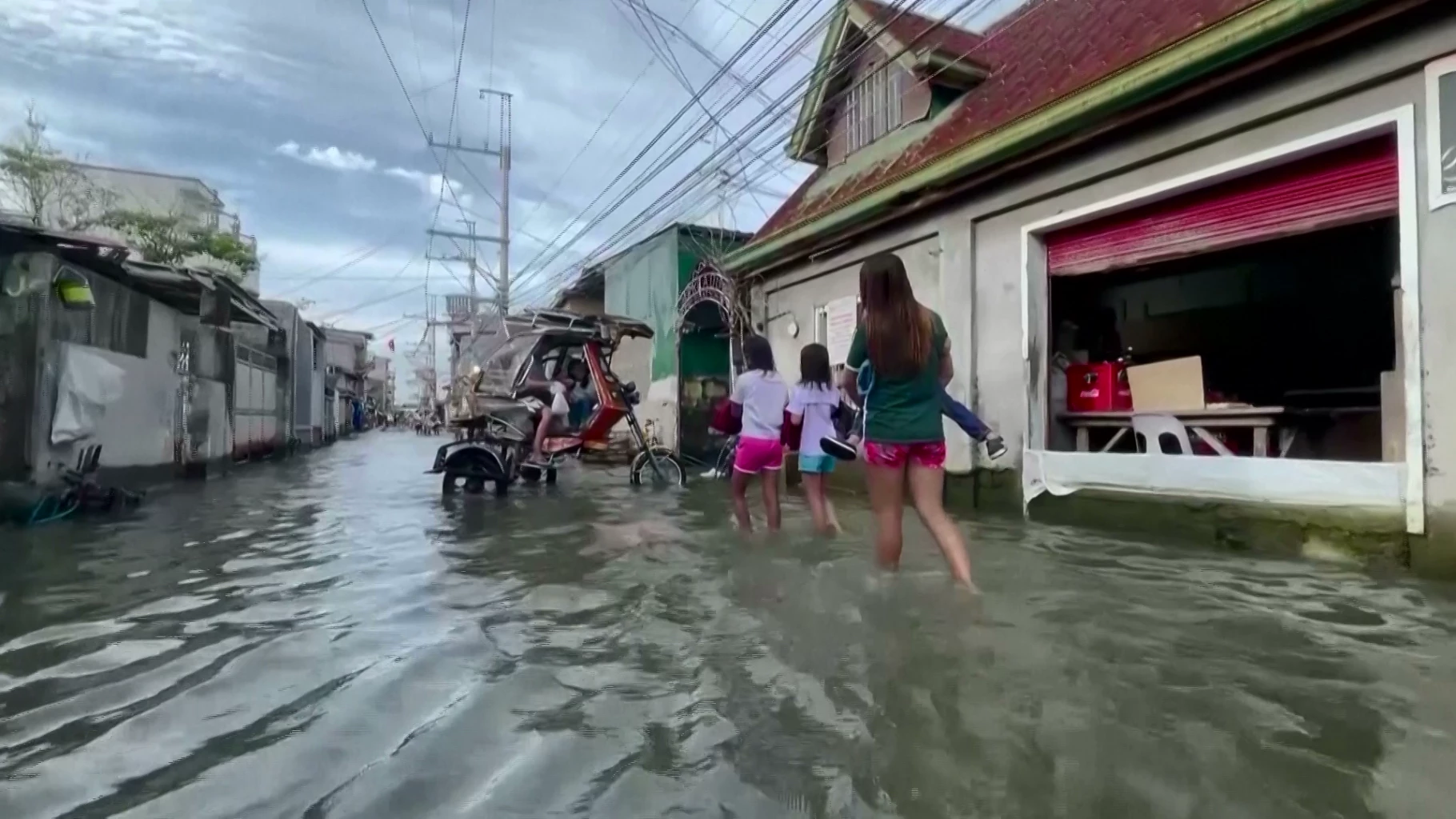 Philippine locals ride high and dry as taxis find ingenious flood solution