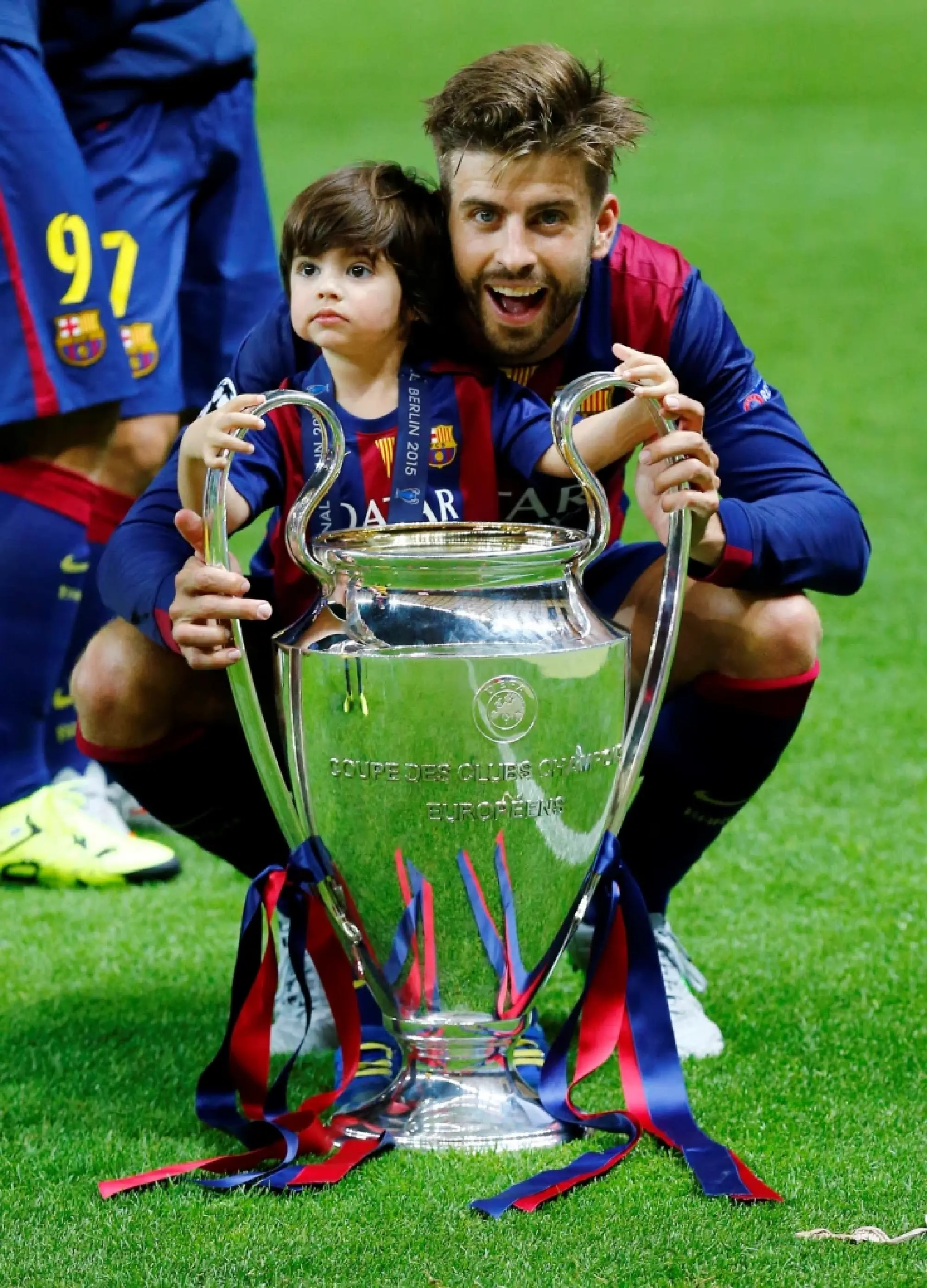 Barcelona's Gerard Pique celebrates with the trophy after winning the UEFA Champions League Reuters