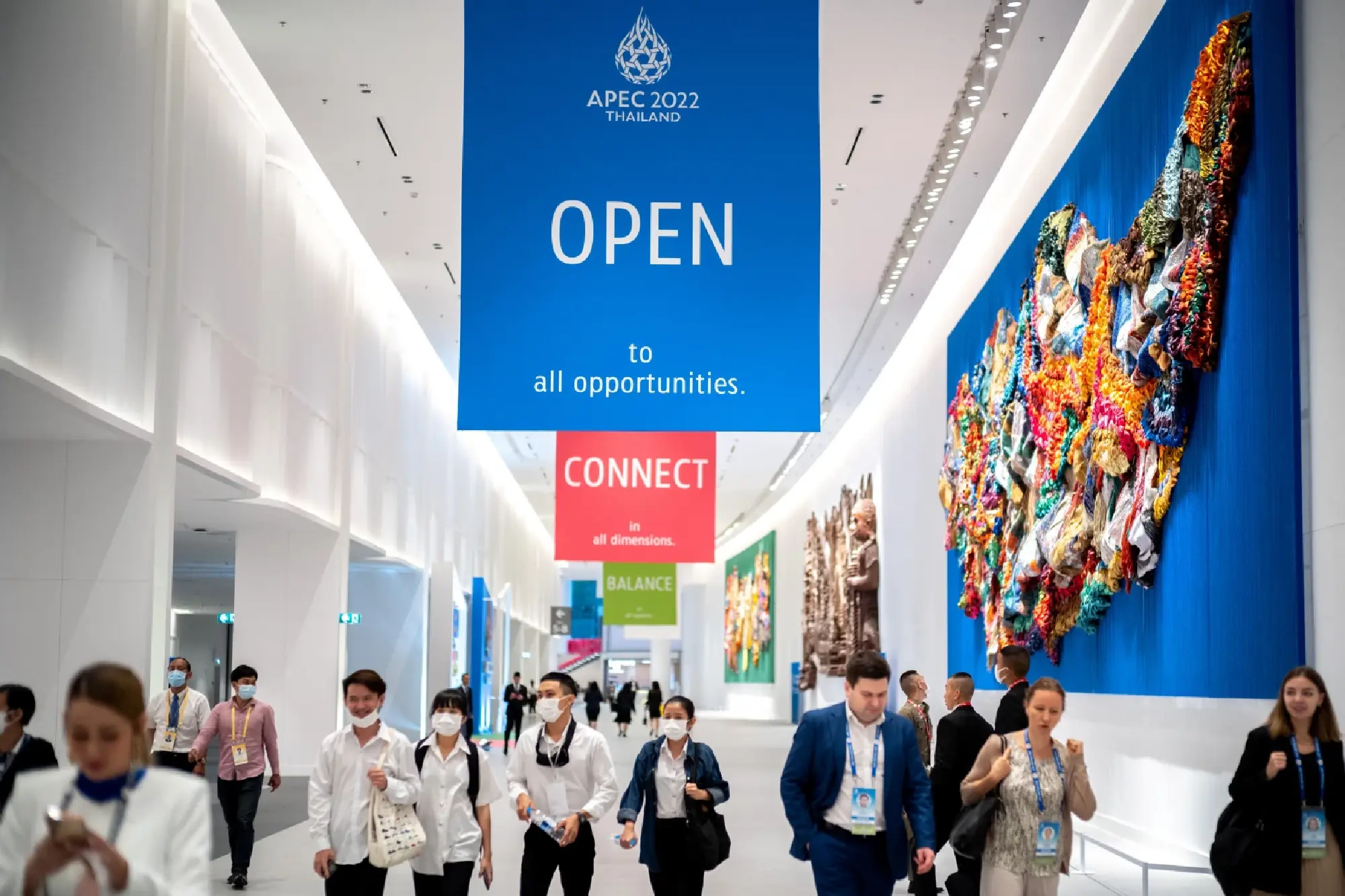 Delegates walk inside the Queen Sirikit National Convention Center where the APEC summit will be held, in Bangkok, Thailand, November 14, 2022. REUTERS/Athit Perawongmetha