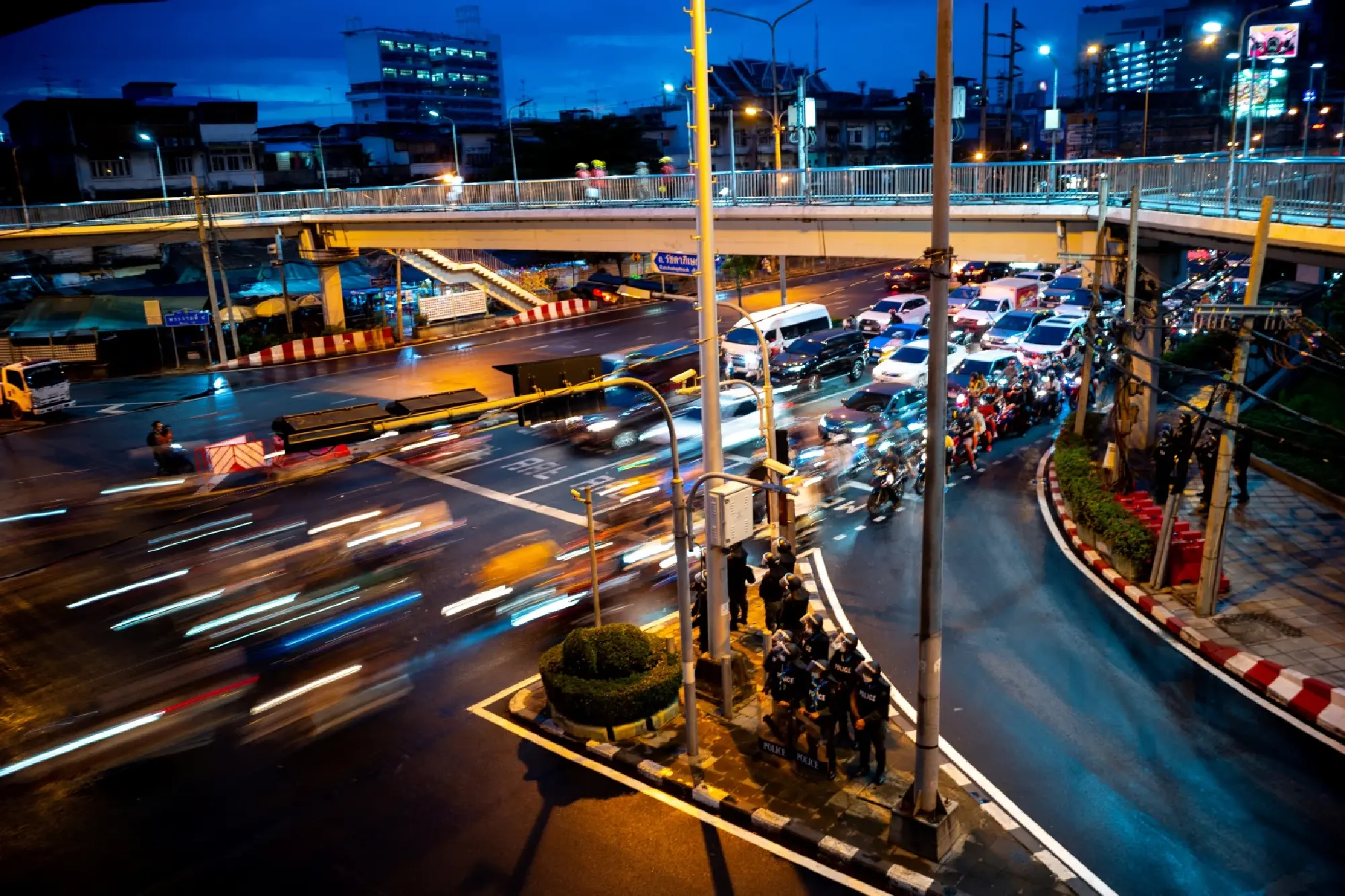 Riot police officers stand guard near the Queen Sirikit National Convention Center where the APEC summit will be held, in Bangkok, Thailand, November 14, 2022. REUTERS/Athit Perawongmetha