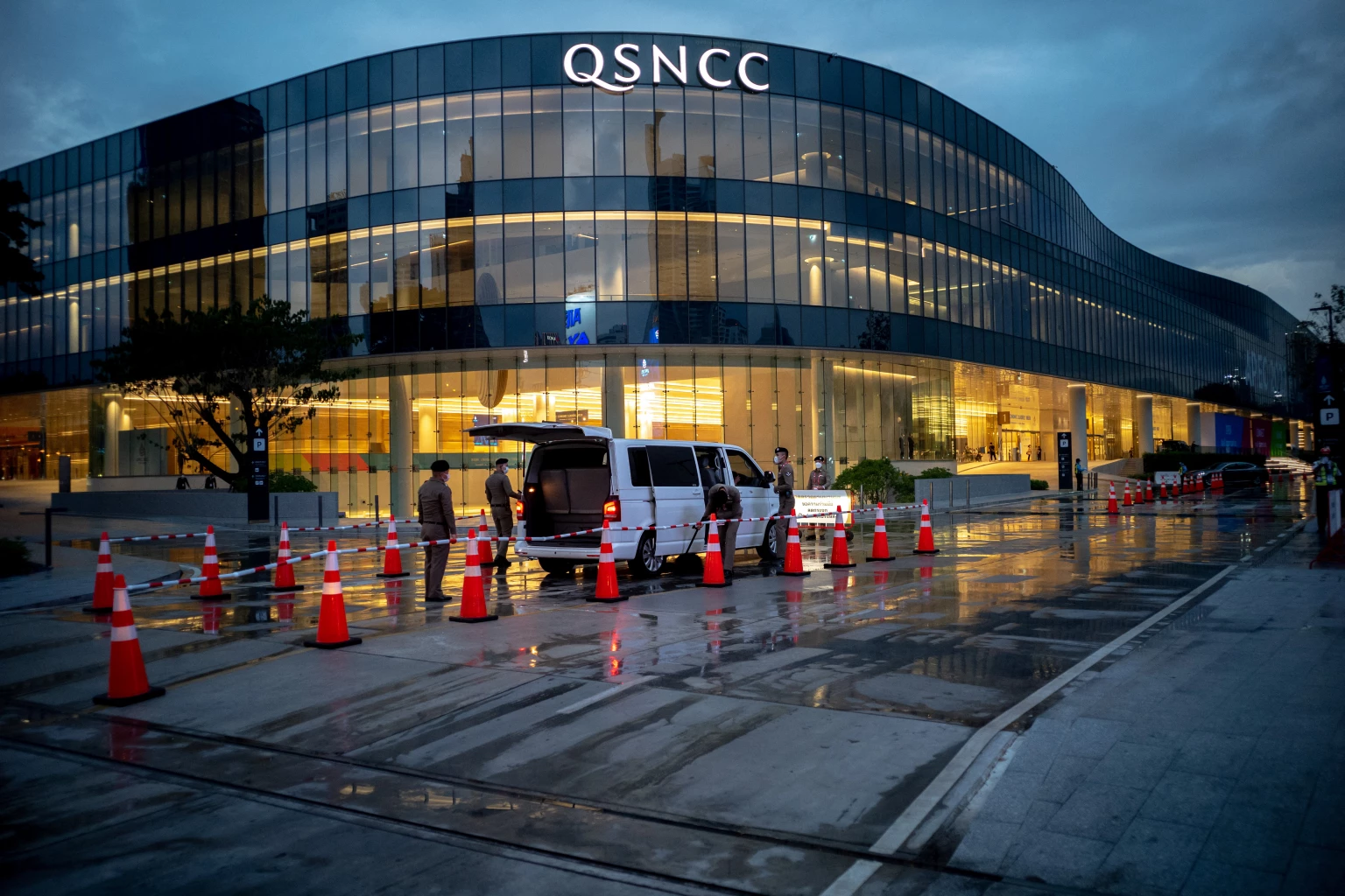 Police officers check a vehicle in front of the Queen Sirikit National Convention Center where the APEC summit will be held, in Bangkok, Thailand, November 14, 2022. REUTERS/Athit Perawongmetha