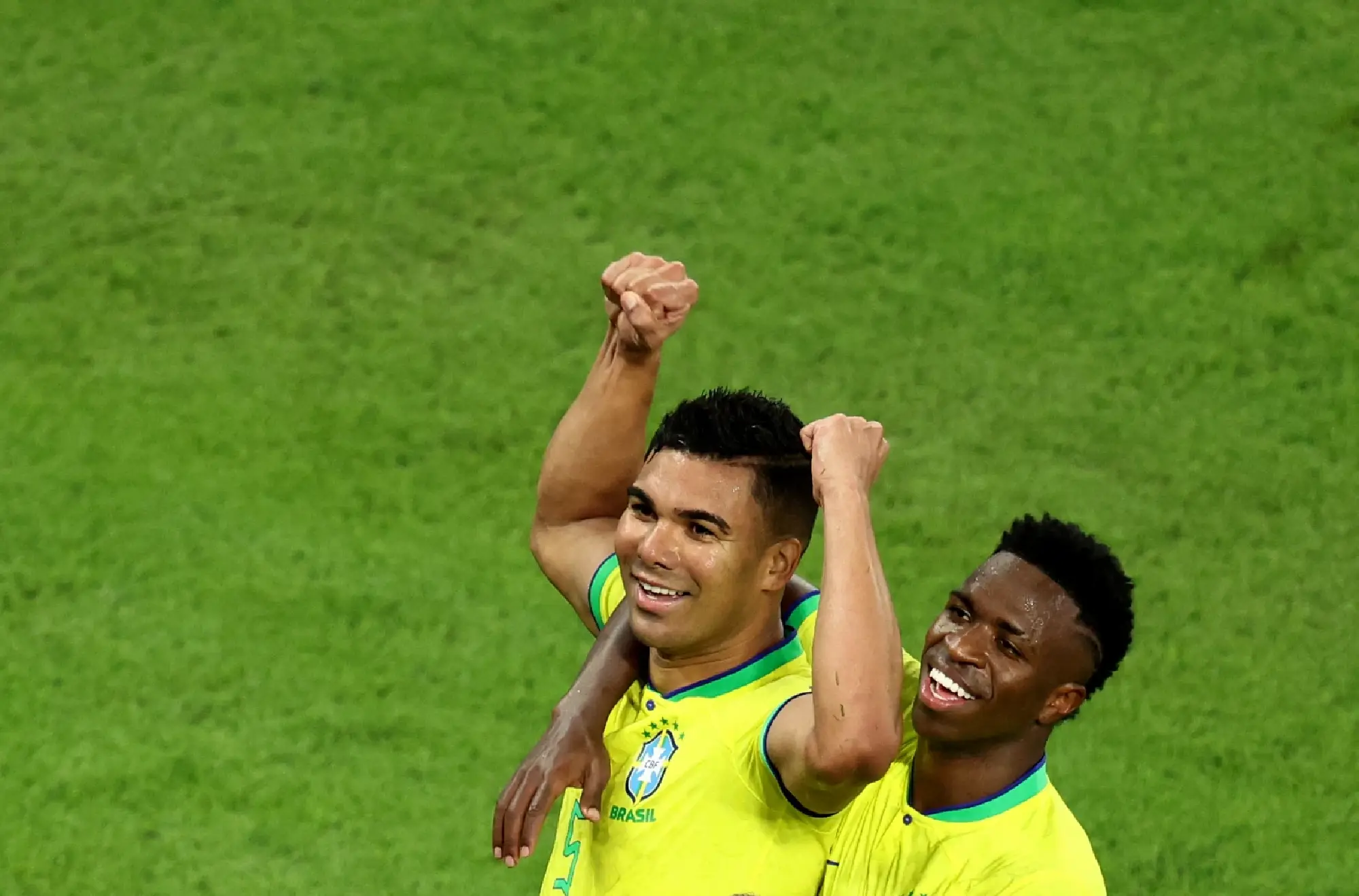  Brazil's Casemiro celebrates scoring their first goal with Vinicius Junior