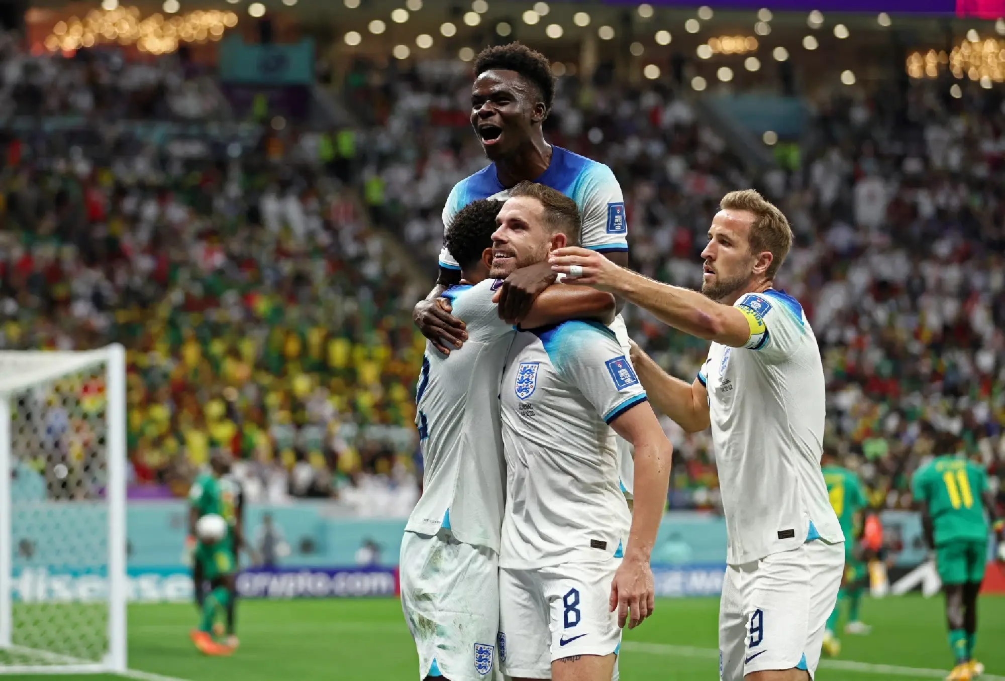 England's Jordan Henderson celebrates scoring their first goal with teammates