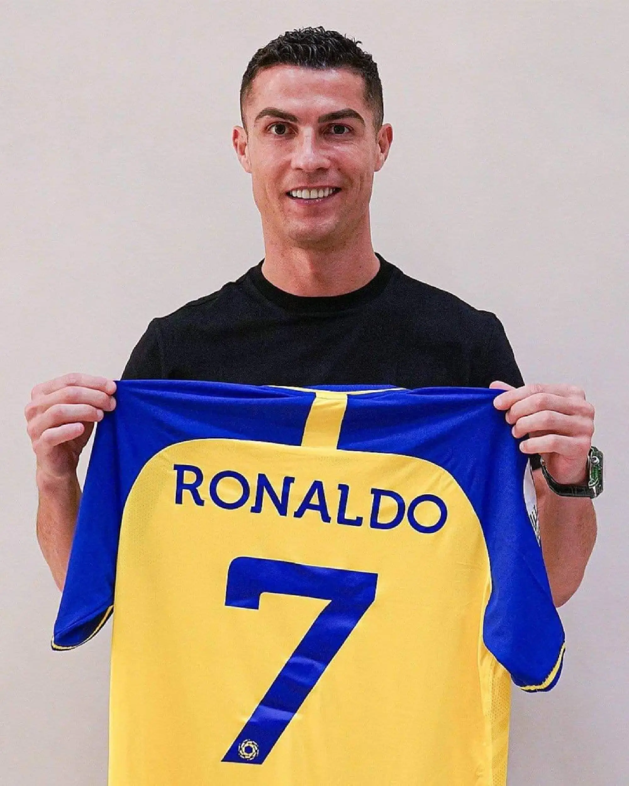 Ronaldo poses with Al Nassr shirt after signing for Saudi club