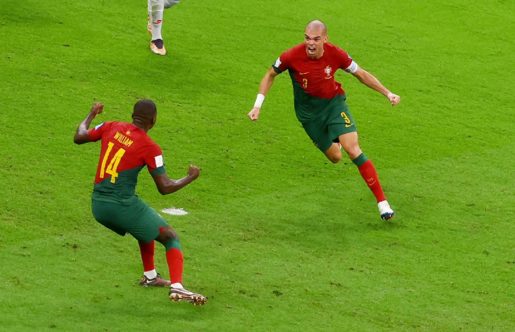 Portugal's Pepe celebrates scoring their second goal with teammate William Carvalho