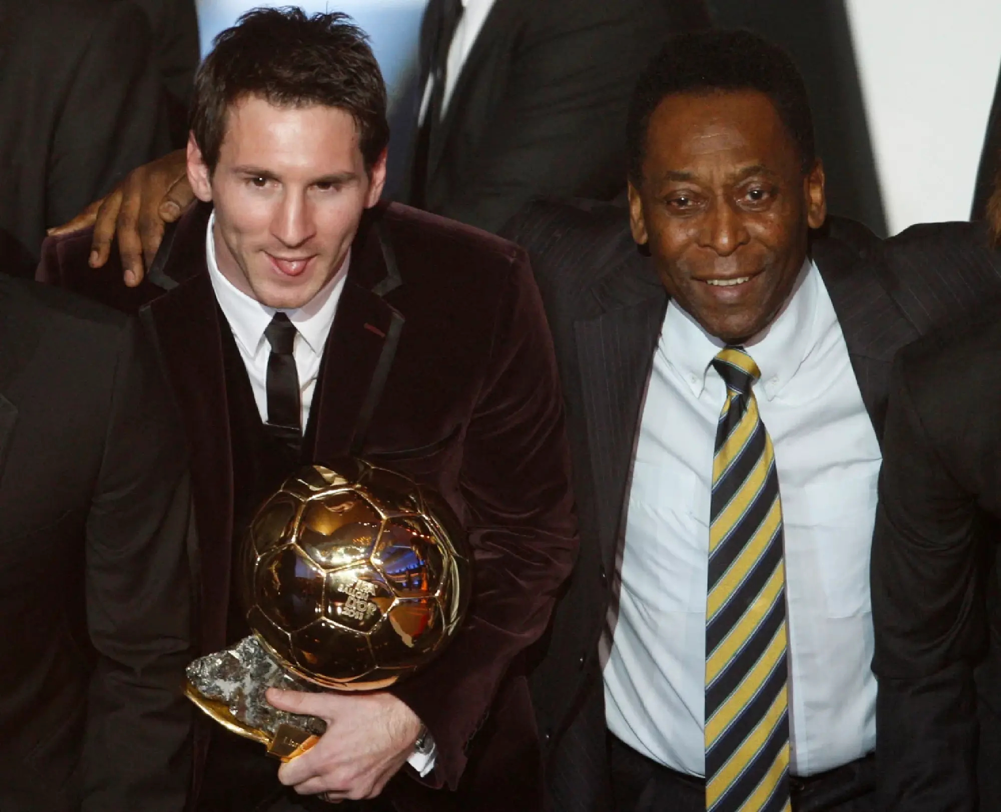 Lionel Messi of Argentina (L), FIFA World Player of the Year holds his FIFA Ballon d'Or 2011 trophy next to Pele during the FIFA Ballon d'Or 2011 soccer awards ceremony at the Kongresshaus in Zurich January 9, 2012.