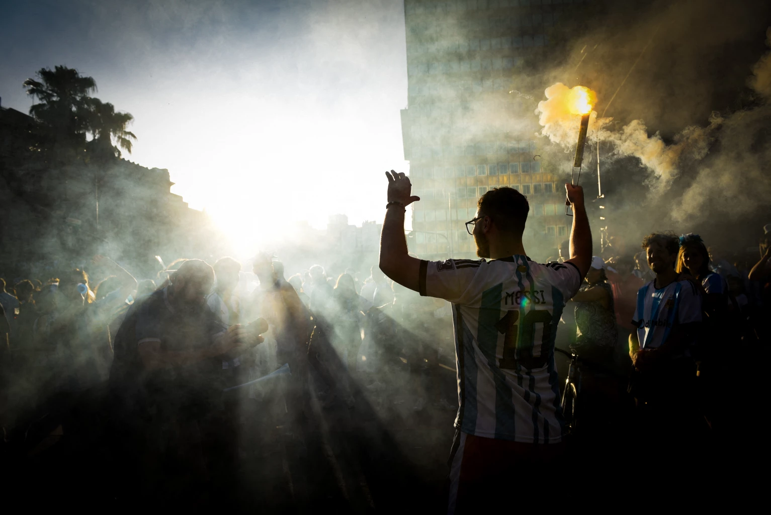 General view as Argentina fans celebrate with flares after winning the World Cup 