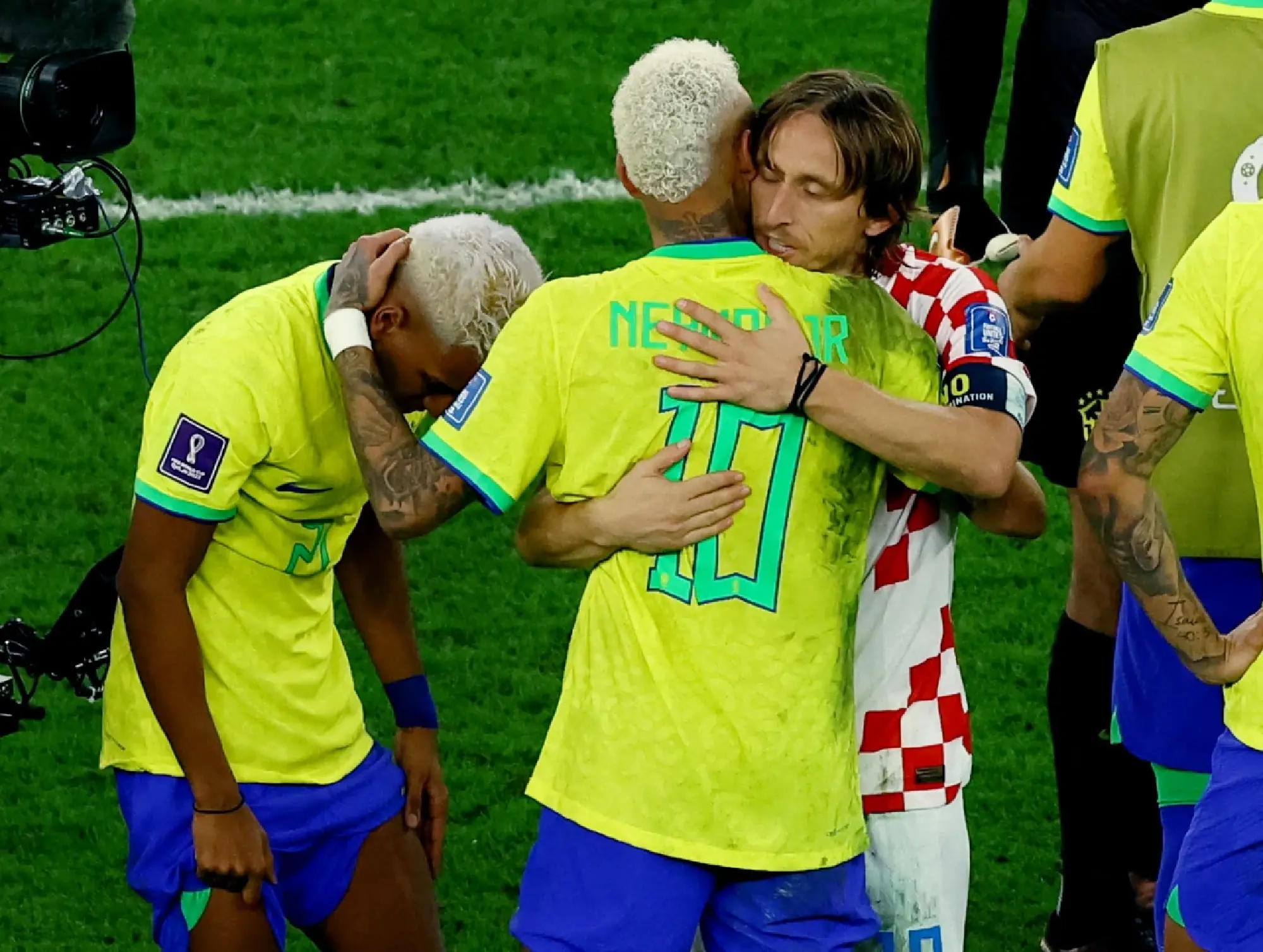 Croatia\'s Luka Modric hugs Brazil\'s Neymar after qualifying for the semi finals