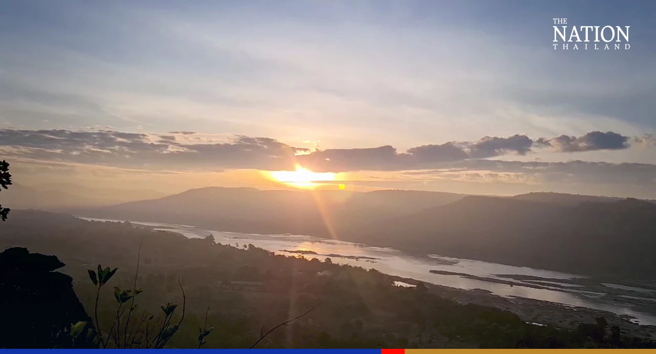 Tourists gather on a sacred mountain in Ubon for New Year sunrise